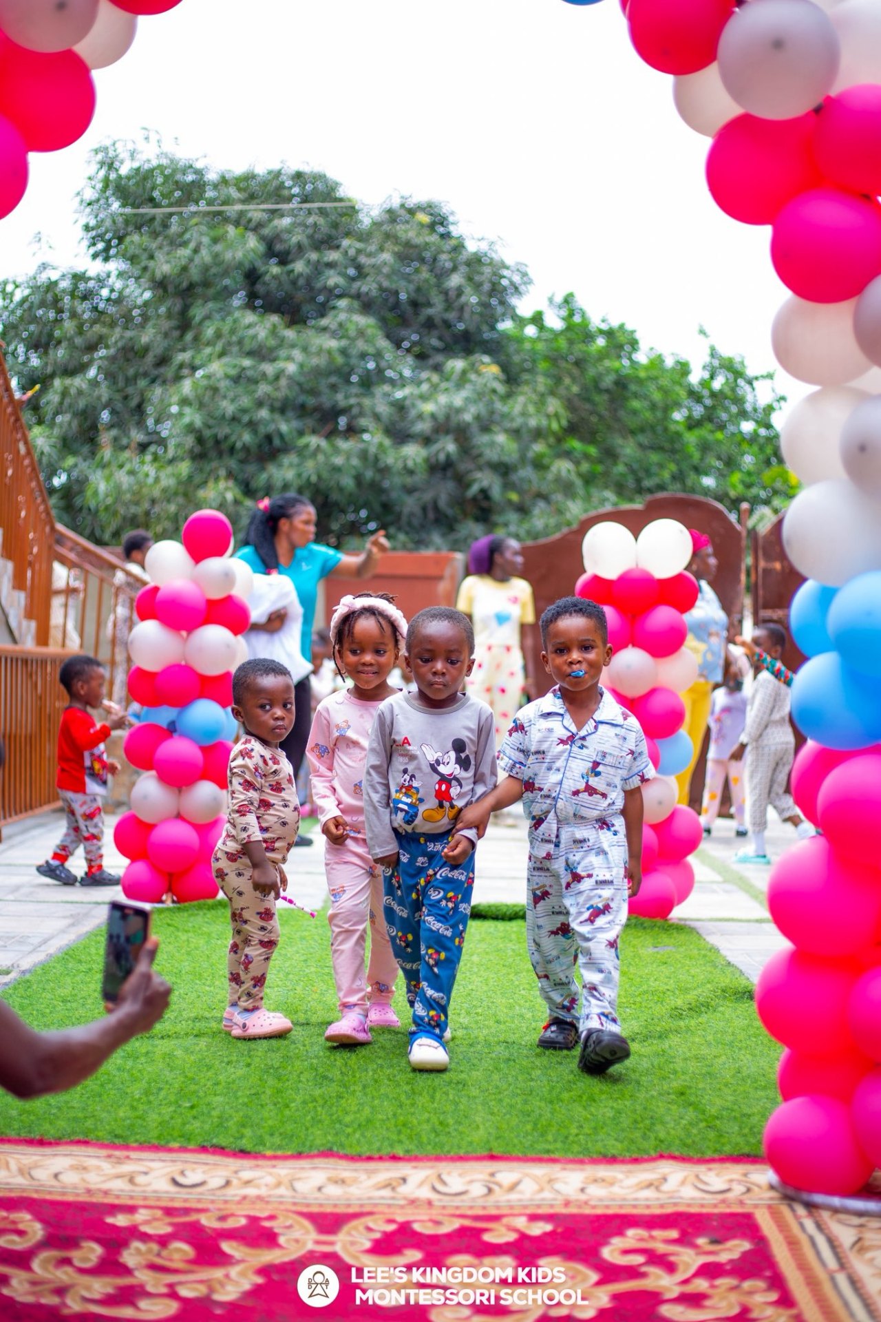 Children playing with balloons in classroom